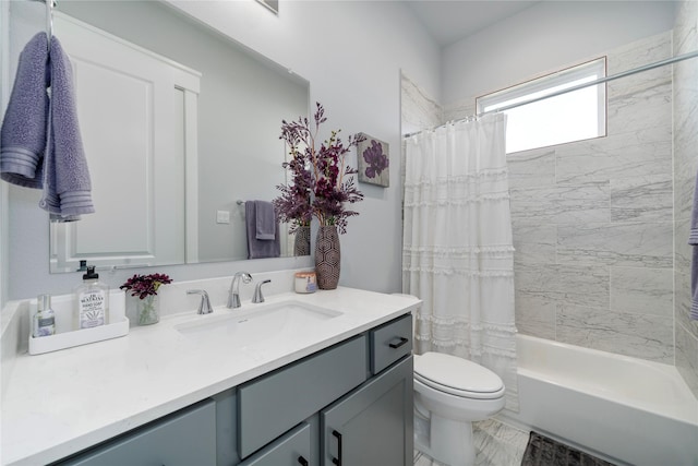 full bathroom with shower / bath combo, vanity, and toilet