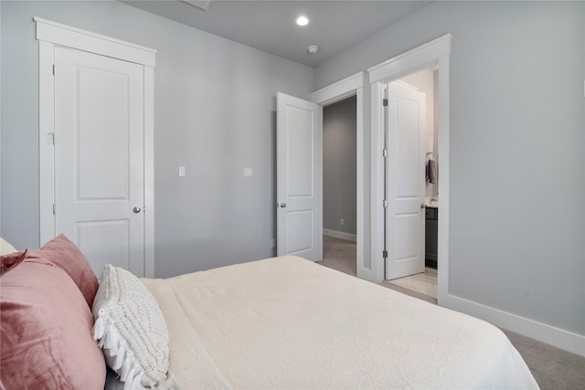 carpeted bedroom featuring a closet