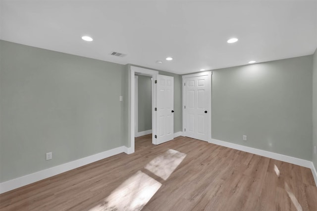 unfurnished room featuring light hardwood / wood-style floors