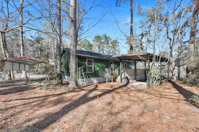 view of front of home featuring a carport