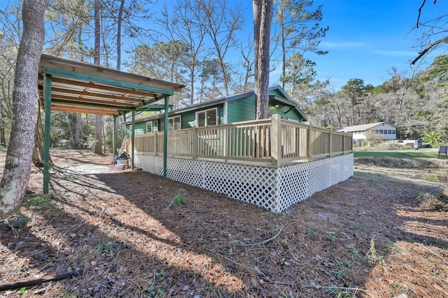 view of side of property with a deck