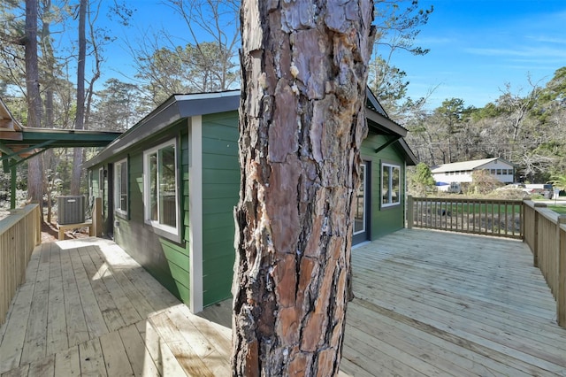 wooden deck with central air condition unit