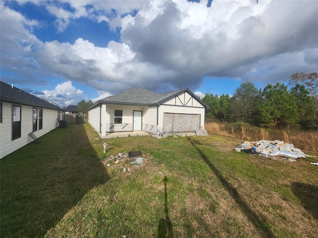 exterior space featuring a lawn and a patio