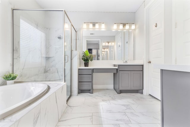 bathroom featuring vanity and separate shower and tub