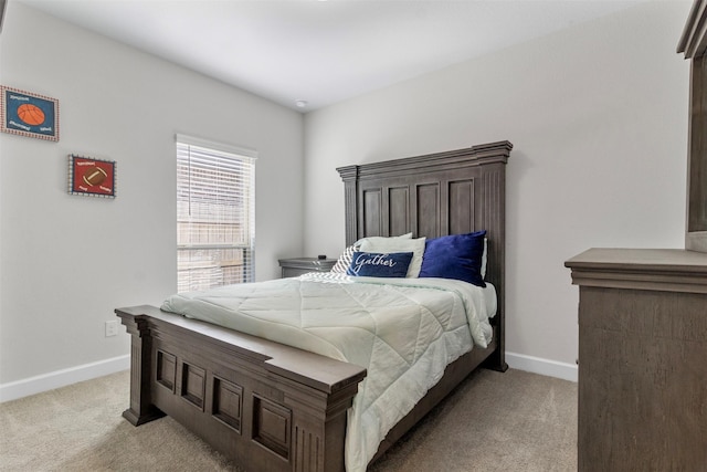 bedroom featuring light colored carpet