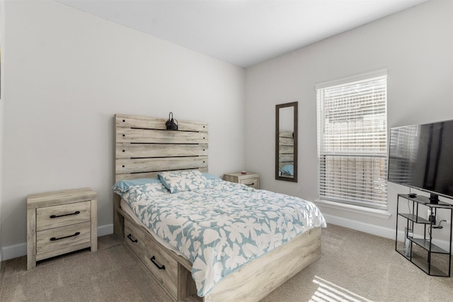 bedroom featuring light carpet