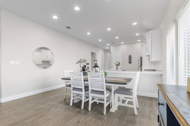 dining area with light hardwood / wood-style flooring