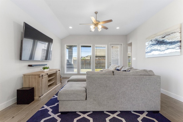 living room featuring wood-type flooring, ceiling fan, and lofted ceiling