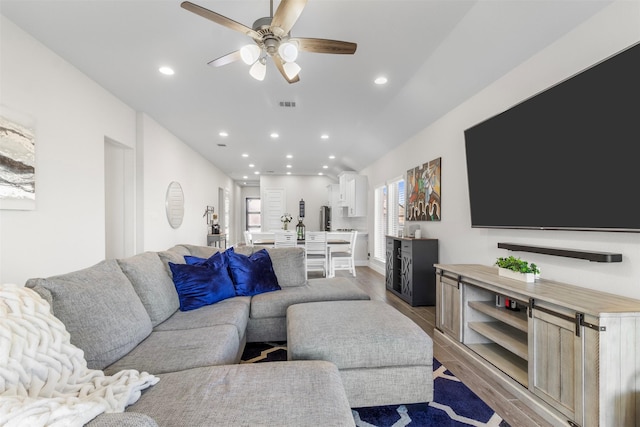 living room with ceiling fan and hardwood / wood-style floors