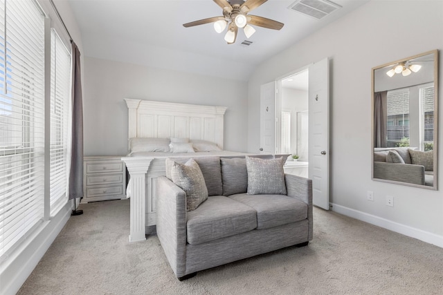 carpeted bedroom with ceiling fan and lofted ceiling