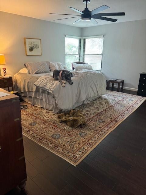 bedroom featuring hardwood / wood-style flooring and ceiling fan