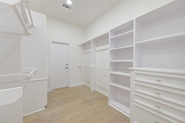 walk in closet featuring light hardwood / wood-style floors