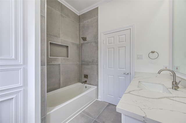 bathroom featuring vanity, tiled shower / bath combo, tile patterned floors, and ornamental molding