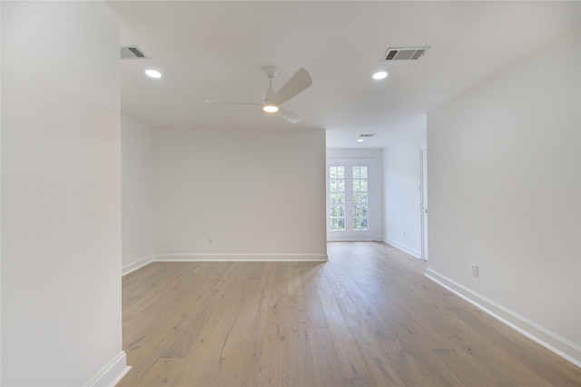 spare room with ceiling fan and light hardwood / wood-style flooring