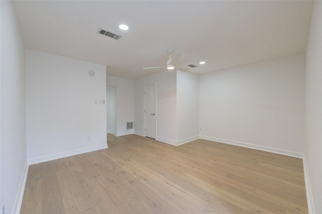 empty room featuring ceiling fan and light wood-type flooring