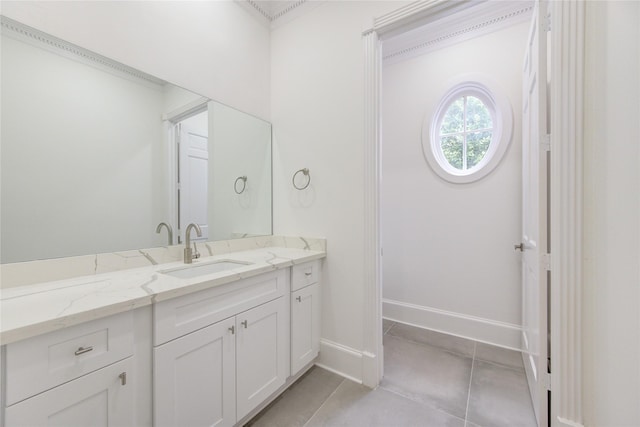 bathroom with vanity and ornamental molding