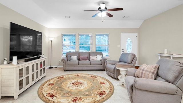 living room with light tile patterned floors, ceiling fan, visible vents, and baseboards