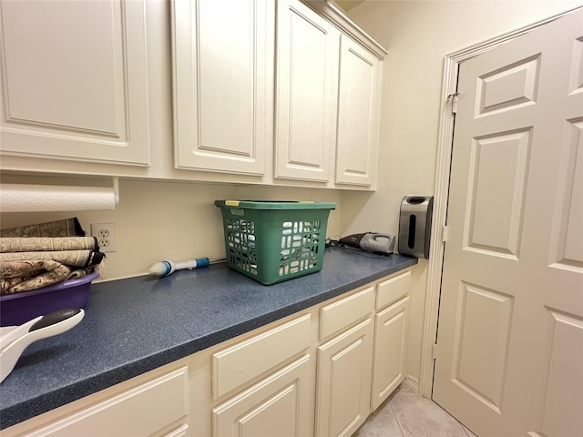 washroom with light tile patterned flooring