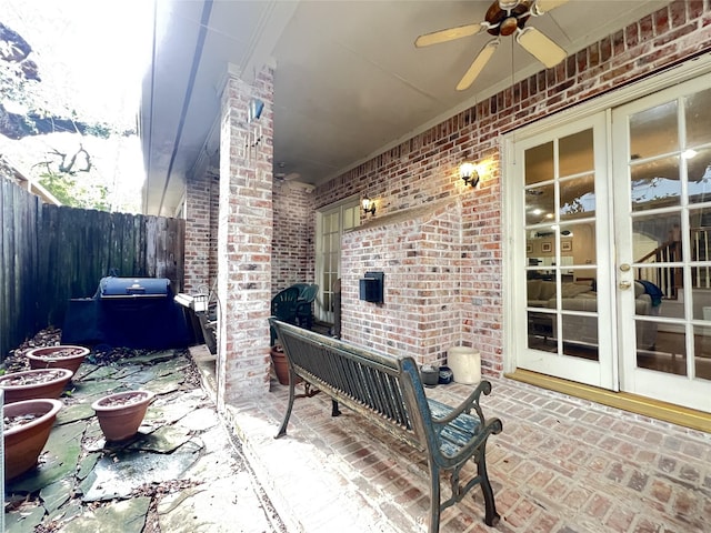 view of patio featuring ceiling fan, grilling area, and french doors