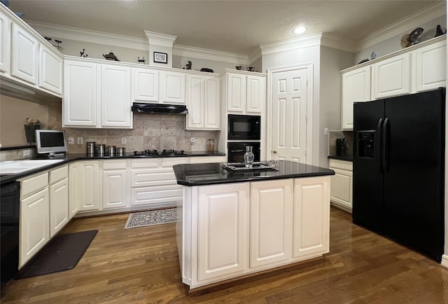 kitchen with white cabinets, a kitchen island, dark wood-type flooring, and black appliances