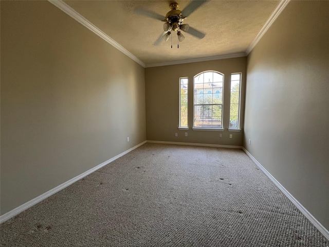 empty room with light carpet, a textured ceiling, ceiling fan, and ornamental molding