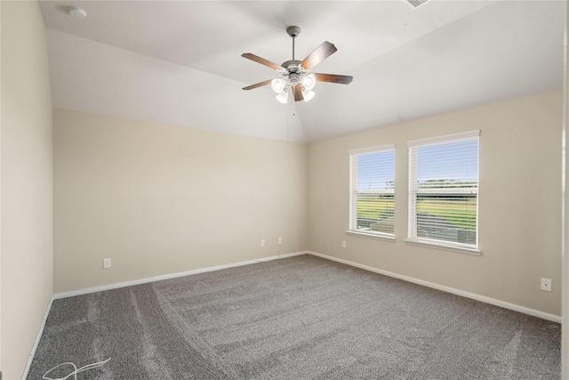 unfurnished room featuring ceiling fan, carpet floors, and vaulted ceiling