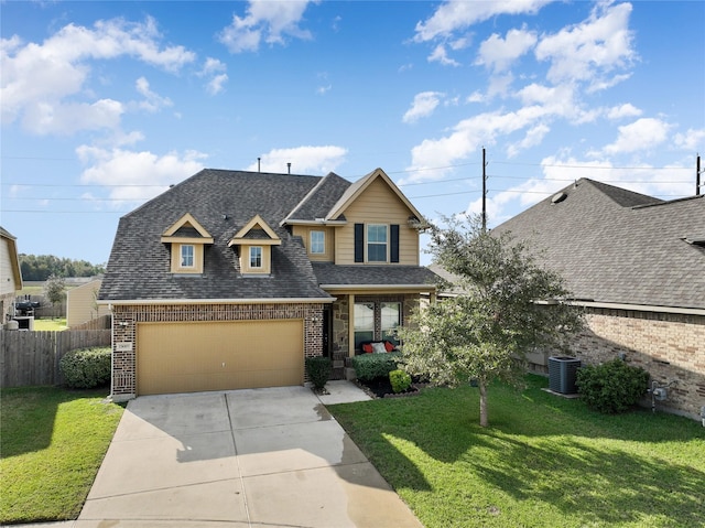 view of front of home with central AC, a garage, and a front lawn