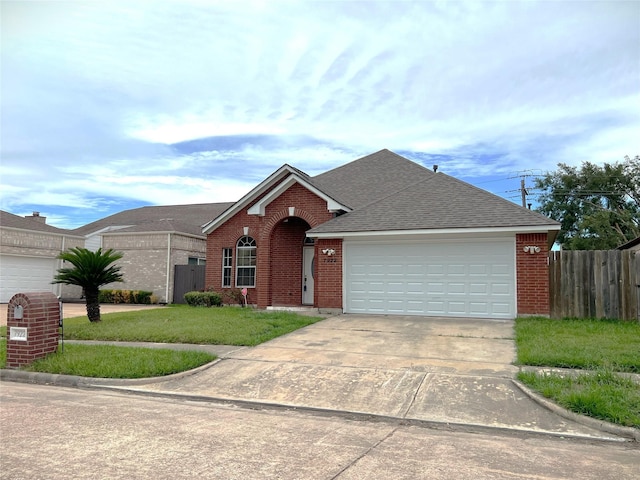 ranch-style house featuring a garage and a front lawn