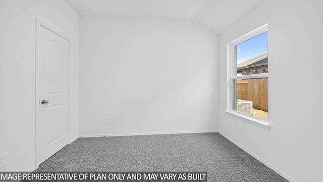 carpeted empty room with vaulted ceiling