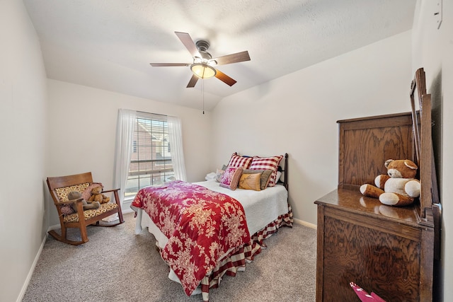 bedroom featuring carpet floors, ceiling fan, and lofted ceiling