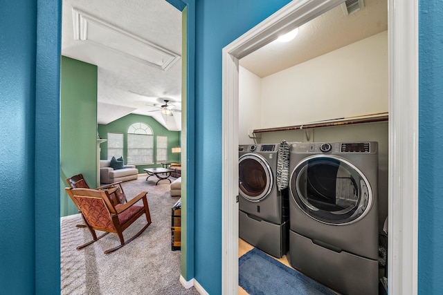 laundry room featuring carpet, washer and clothes dryer, and ceiling fan