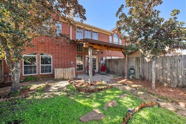 rear view of house featuring a patio