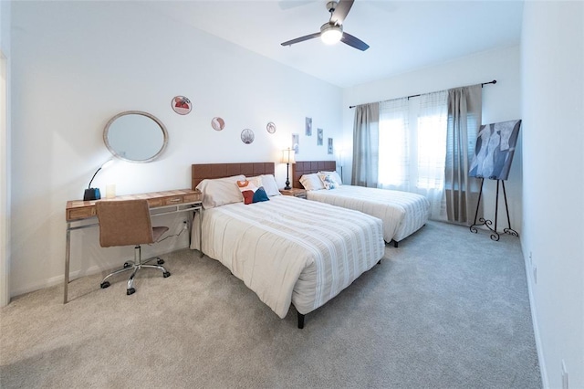 bedroom featuring ceiling fan and light carpet