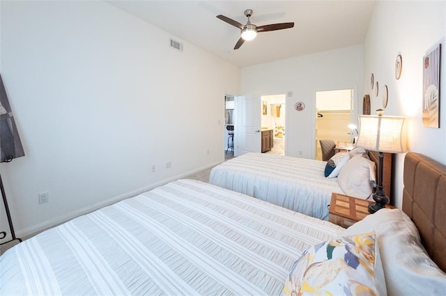 bedroom with connected bathroom, ceiling fan, and carpet floors