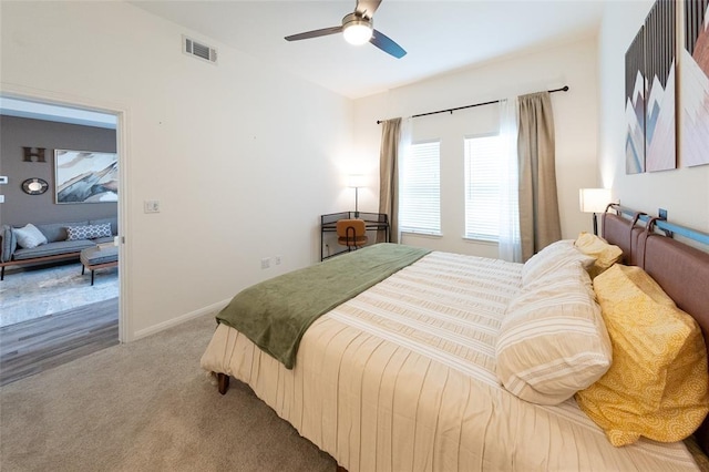 bedroom featuring ceiling fan and carpet