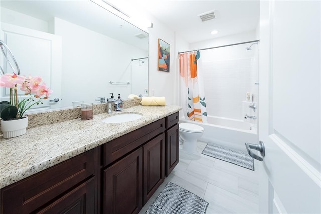 full bathroom with tile patterned flooring, shower / bath combination with curtain, vanity, and toilet