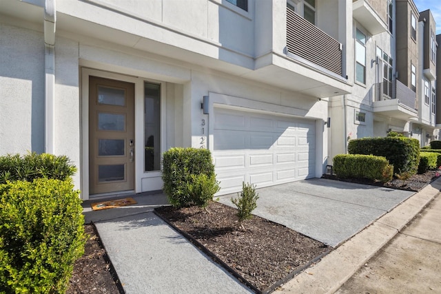 view of exterior entry featuring a garage