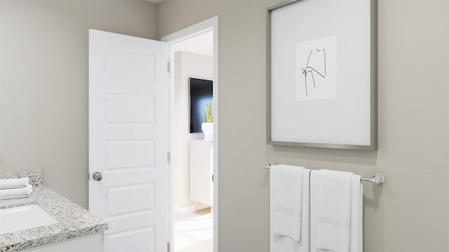 bathroom with radiator heating unit and vanity