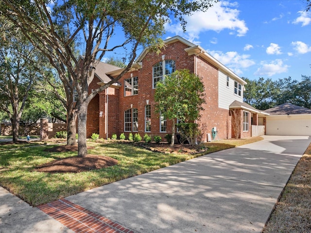 view of front of home featuring a garage and a front yard