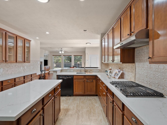 kitchen featuring kitchen peninsula, decorative backsplash, stainless steel gas cooktop, sink, and black dishwasher