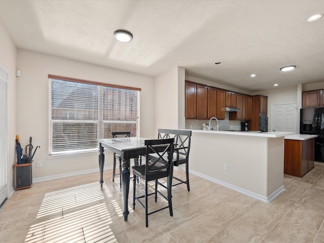 dining area featuring sink