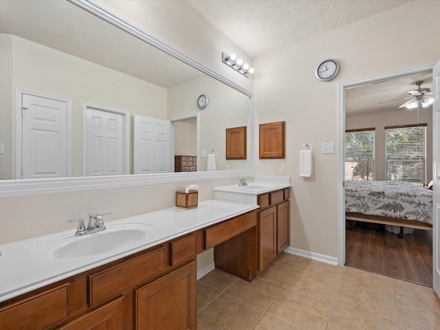 bathroom featuring tile patterned floors, ceiling fan, a textured ceiling, and vanity