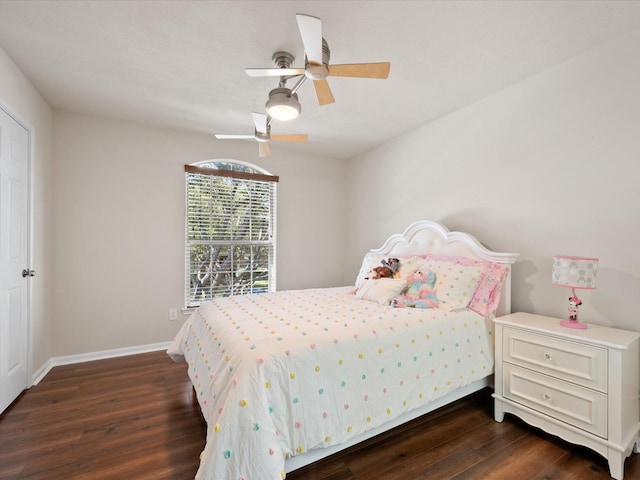 bedroom with ceiling fan and dark hardwood / wood-style floors