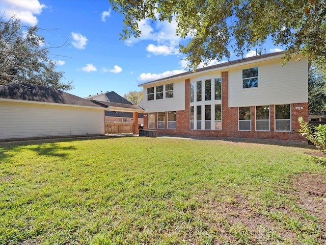 back of property featuring a lawn