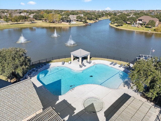 view of swimming pool with a patio area and a water view