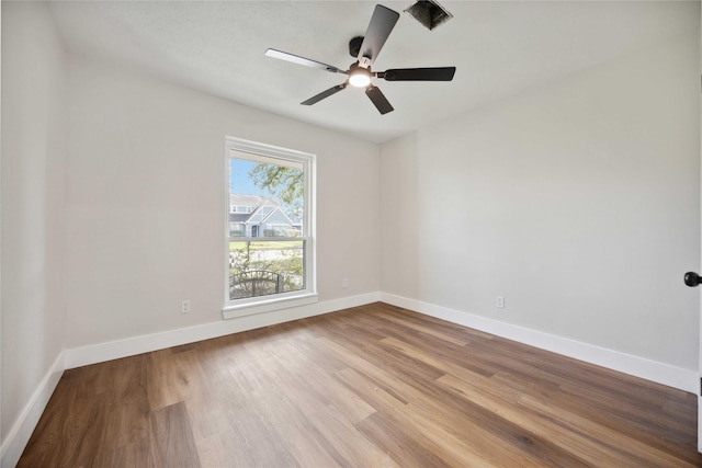 empty room featuring ceiling fan and light wood-type flooring