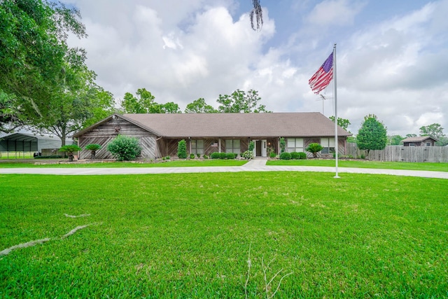 single story home featuring a front yard