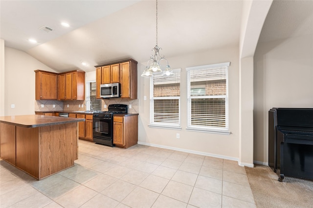 kitchen featuring black electric range oven, backsplash, a chandelier, lofted ceiling, and light tile patterned flooring