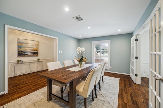 dining room featuring dark wood-type flooring and french doors