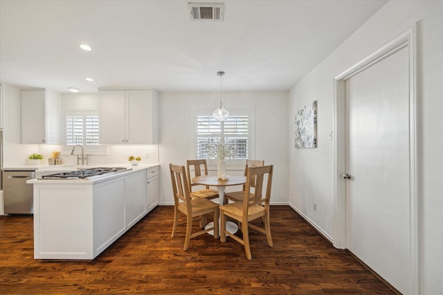 dining room featuring dark hardwood / wood-style flooring